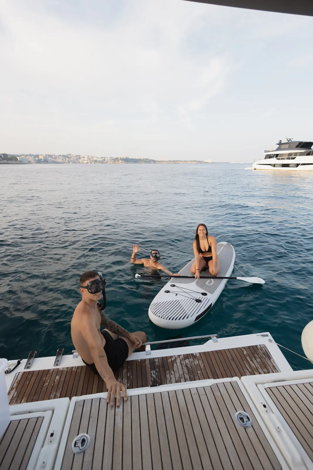 Islander Charter paddleboarding in clear Mallorca waters